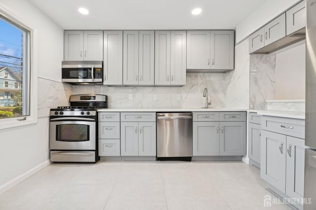 210 N 2nd Ave, Highland Park, NJ 08904 - kitchen with stainless steel appliances, gray cabinets, plenty of natural light, and recessed lighting