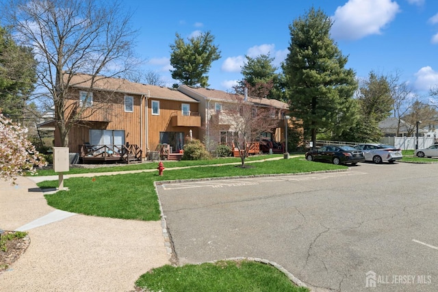 210 N 2nd Ave, Highland Park, NJ 08904 - view of building exterior featuring uncovered parking