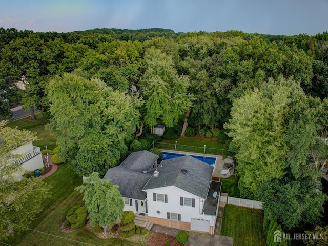 view from above of property with a forest