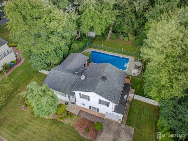 view of subject property with a pool area