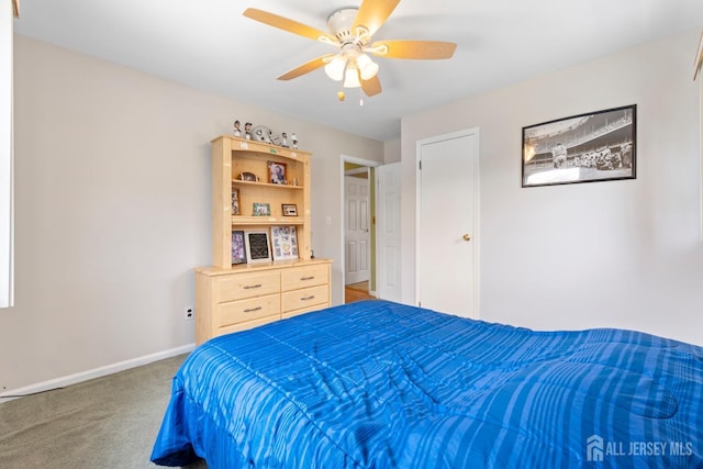 bedroom with carpet floors, baseboards, and ceiling fan