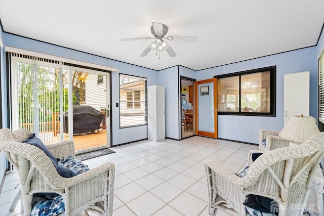 living room featuring a ceiling fan and light tile patterned floors