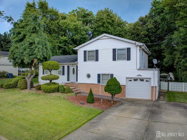 split level home featuring brick siding, a garage, and concrete driveway