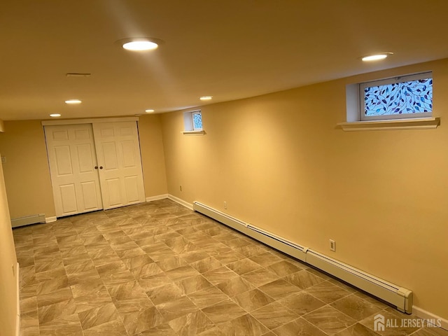 basement featuring a baseboard radiator