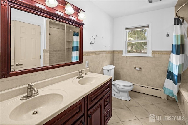 full bathroom featuring toilet, tile patterned flooring, a baseboard heating unit, and a sink