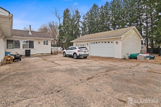 exterior space with a garage and fence