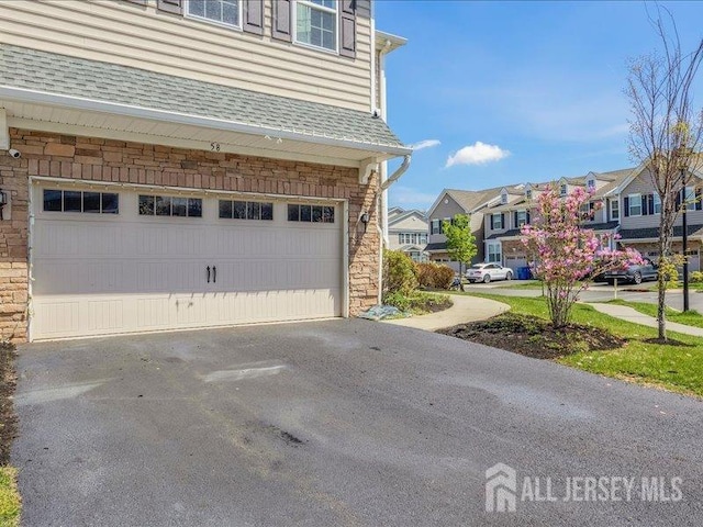 58 Begonia Ln, Monroe, NJ 08831 - garage with a residential view and asphalt driveway