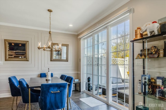 58 Begonia Ln, Monroe, NJ 08831 - dining space featuring a chandelier, dark wood-type flooring, and ornamental molding