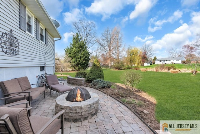 view of patio featuring an outdoor fire pit
