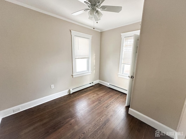 spare room featuring ceiling fan, a baseboard heating unit, dark wood-style flooring, baseboards, and ornamental molding