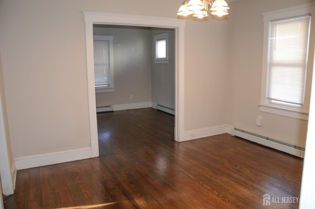 unfurnished dining area featuring dark wood-style floors, a baseboard radiator, and a notable chandelier