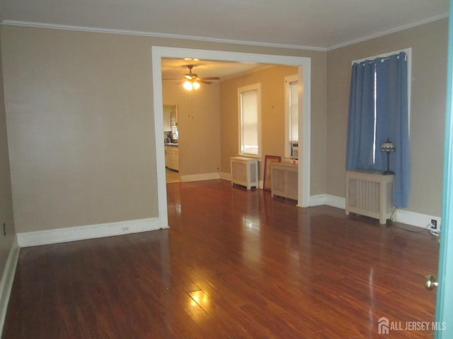 458 S Barclay St, Perth Amboy, NJ 08861 - spare room featuring ornamental molding, wood finished floors, a ceiling fan, and radiator