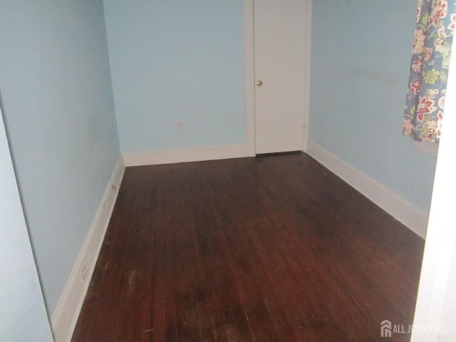 458 S Barclay St, Perth Amboy, NJ 08861 - unfurnished room with dark wood finished floors and baseboards
