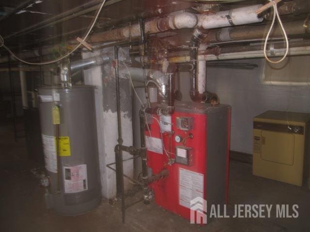 458 S Barclay St, Perth Amboy, NJ 08861 - utilities featuring water heater and washer / dryer