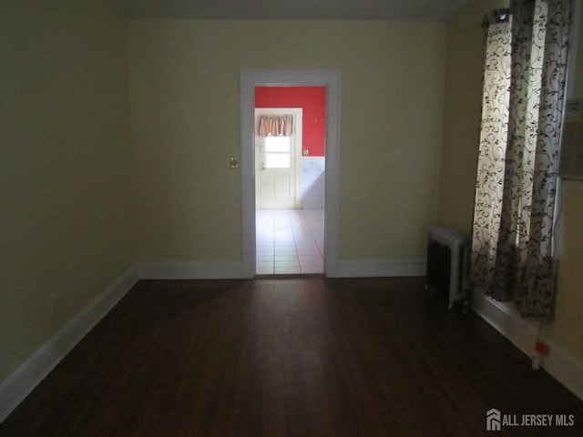 458 S Barclay St, Perth Amboy, NJ 08861 - unfurnished room with radiator and wood finished floors