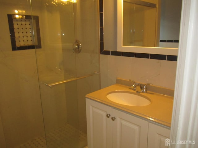 458 S Barclay St, Perth Amboy, NJ 08861 - bathroom with vanity, a stall shower, and tile walls