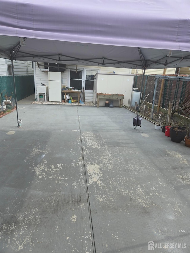 533 W Side Ave W, Perth Amboy, NJ 08861 - garage with fence and freestanding refrigerator