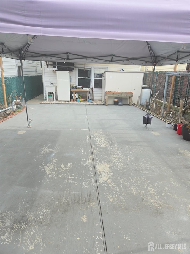 533 W Side Ave W, Perth Amboy, NJ 08861 - garage with fence and freestanding refrigerator