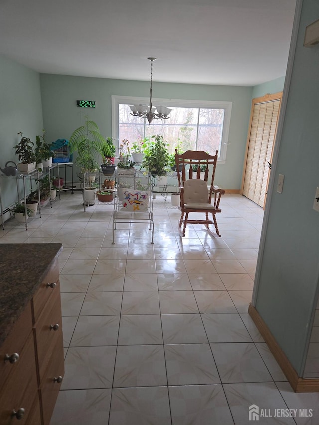 533 W Side Ave W, Perth Amboy, NJ 08861 - dining room with a chandelier, baseboards, and light tile patterned floors