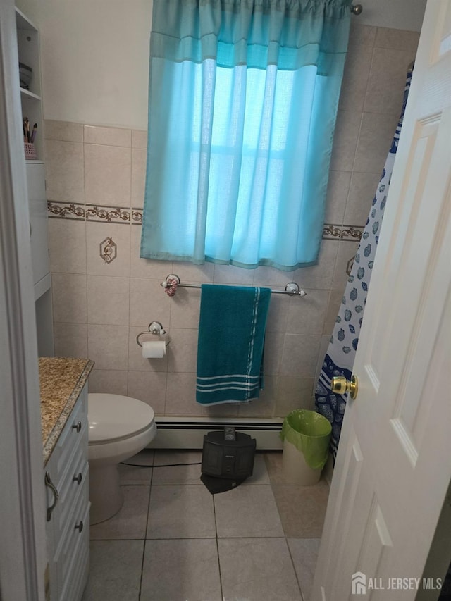 533 W Side Ave W, Perth Amboy, NJ 08861 - bathroom with a baseboard radiator, tile walls, tile patterned floors, vanity, and toilet