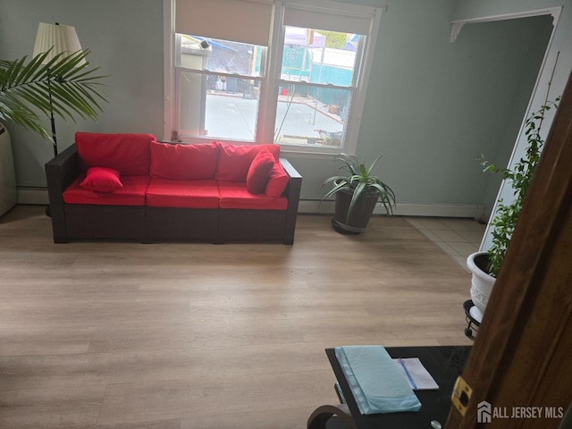 533 W Side Ave W, Perth Amboy, NJ 08861 - living area with wood finished floors, a baseboard radiator, baseboard heating, and baseboards