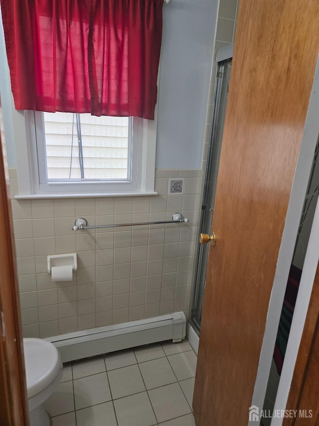 533 W Side Ave W, Perth Amboy, NJ 08861 - bathroom with tile patterned floors, baseboard heating, a stall shower, tile walls, and toilet