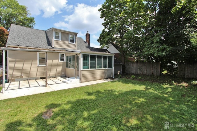 348 Morton Ave, Rahway, NJ 07065 - back of house featuring a chimney, roof with shingles, a sunroom, and a patio area