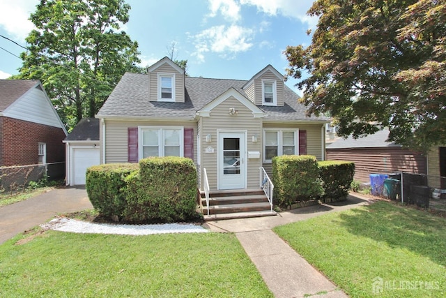 348 Morton Ave, Rahway, NJ 07065 - cape cod-style house with a shingled roof, a garage, driveway, and entry steps