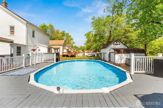 229 Greenbrook Rd, Green Brook, NJ 08812 - view of pool featuring a deck and an outbuilding