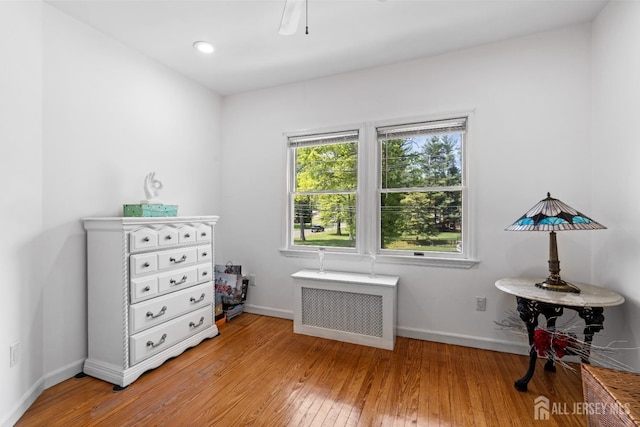 229 Greenbrook Rd, Green Brook, NJ 08812 - bedroom featuring radiator heating unit, light wood-style flooring, and a ceiling fan