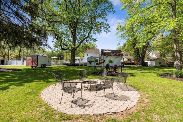 229 Greenbrook Rd, Green Brook, NJ 08812 - view of yard with an outdoor fire pit, a storage unit, and a patio