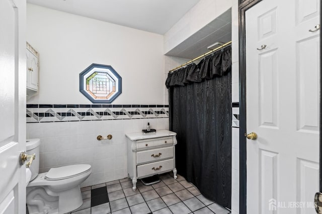 229 Greenbrook Rd, Green Brook, NJ 08812 - bathroom featuring tile walls, tile patterned floors, a shower with shower curtain, and a wainscoted wall