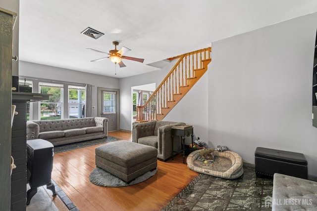 229 Greenbrook Rd, Green Brook, NJ 08812 - living area featuring ceiling fan, stairway, and wood finished floors