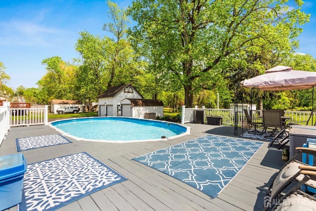 229 Greenbrook Rd, Green Brook, NJ 08812 - view of swimming pool with a gazebo, a wooden deck, a storage shed, and view of scattered trees