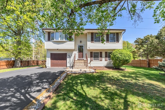 59 Normandy Dr, Piscataway, NJ 08854 - raised ranch with asphalt driveway and a garage