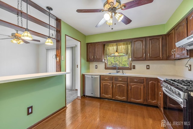 59 Normandy Dr, Piscataway, NJ 08854 - kitchen featuring appliances with stainless steel finishes, ceiling fan, light countertops, and dark wood-style flooring