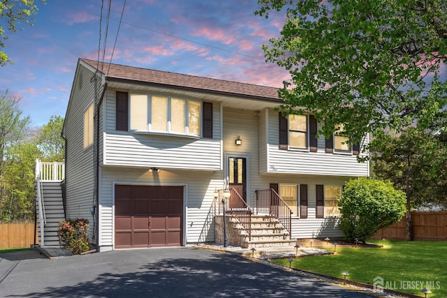 59 Normandy Dr, Piscataway, NJ 08854 - split foyer home with an attached garage and asphalt driveway