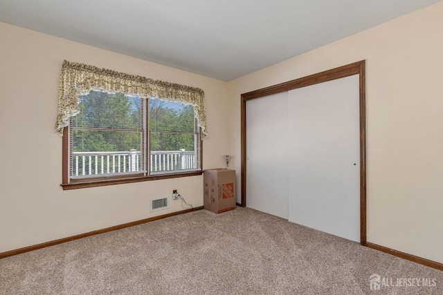 59 Normandy Dr, Piscataway, NJ 08854 - unfurnished bedroom with light colored carpet and a closet