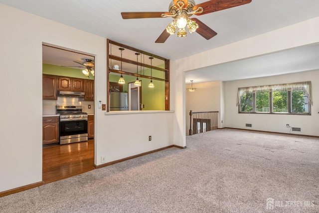 59 Normandy Dr, Piscataway, NJ 08854 - unfurnished living room with carpet flooring and ceiling fan