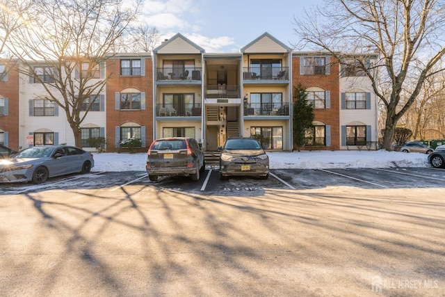 view of property with uncovered parking