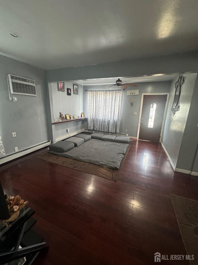 entryway featuring ceiling fan, dark hardwood / wood-style flooring, a wall mounted air conditioner, and a baseboard heating unit