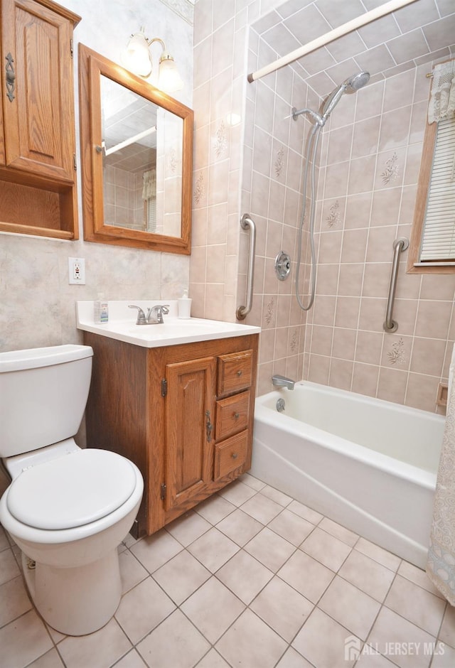 bathroom featuring shower / bath combination, vanity, toilet, and tile patterned floors