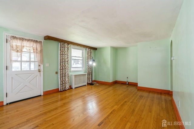 571 Greenbrook Rd, North Plainfield, NJ 07063 - unfurnished living room featuring light wood finished floors and radiator heating unit