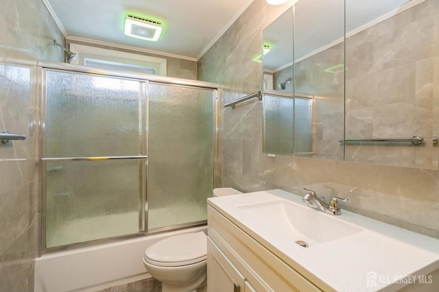 571 Greenbrook Rd, North Plainfield, NJ 07063 - full bathroom featuring tile walls, crown molding, vanity, shower / bath combination with glass door, and backsplash