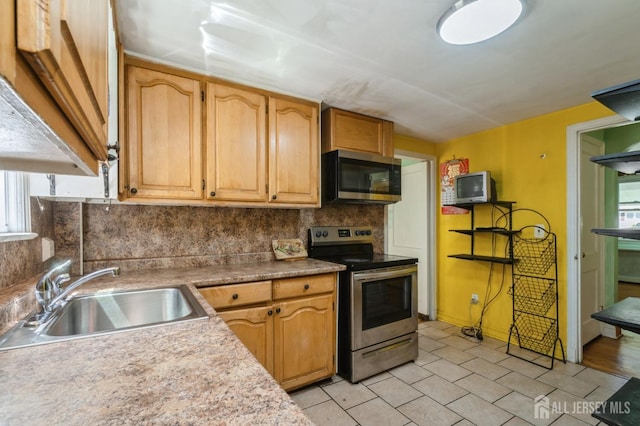571 Greenbrook Rd, North Plainfield, NJ 07063 - kitchen featuring stainless steel appliances, decorative backsplash, light countertops, and light tile patterned floors
