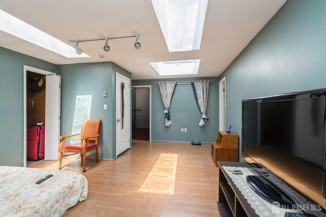 571 Greenbrook Rd, North Plainfield, NJ 07063 - bedroom with track lighting, a skylight, and light wood-type flooring