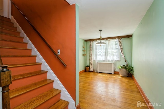 571 Greenbrook Rd, North Plainfield, NJ 07063 - stairway with radiator heating unit and wood finished floors