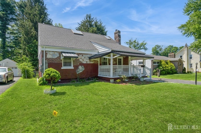 571 Greenbrook Rd, North Plainfield, NJ 07063 - view of front of property featuring covered porch, roof with shingles, a front yard, a chimney, and brick siding