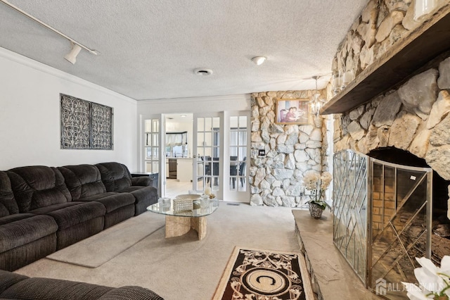 living room featuring crown molding, carpet floors, and a textured ceiling