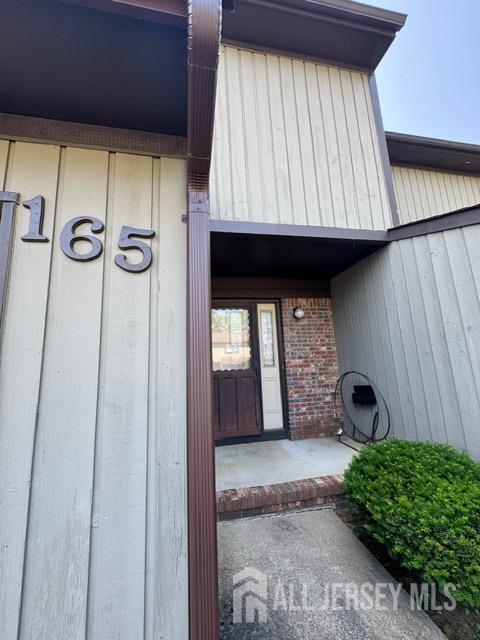 165 Penn Ct, Old Bridge, NJ 07747 - view of exterior entry with brick siding